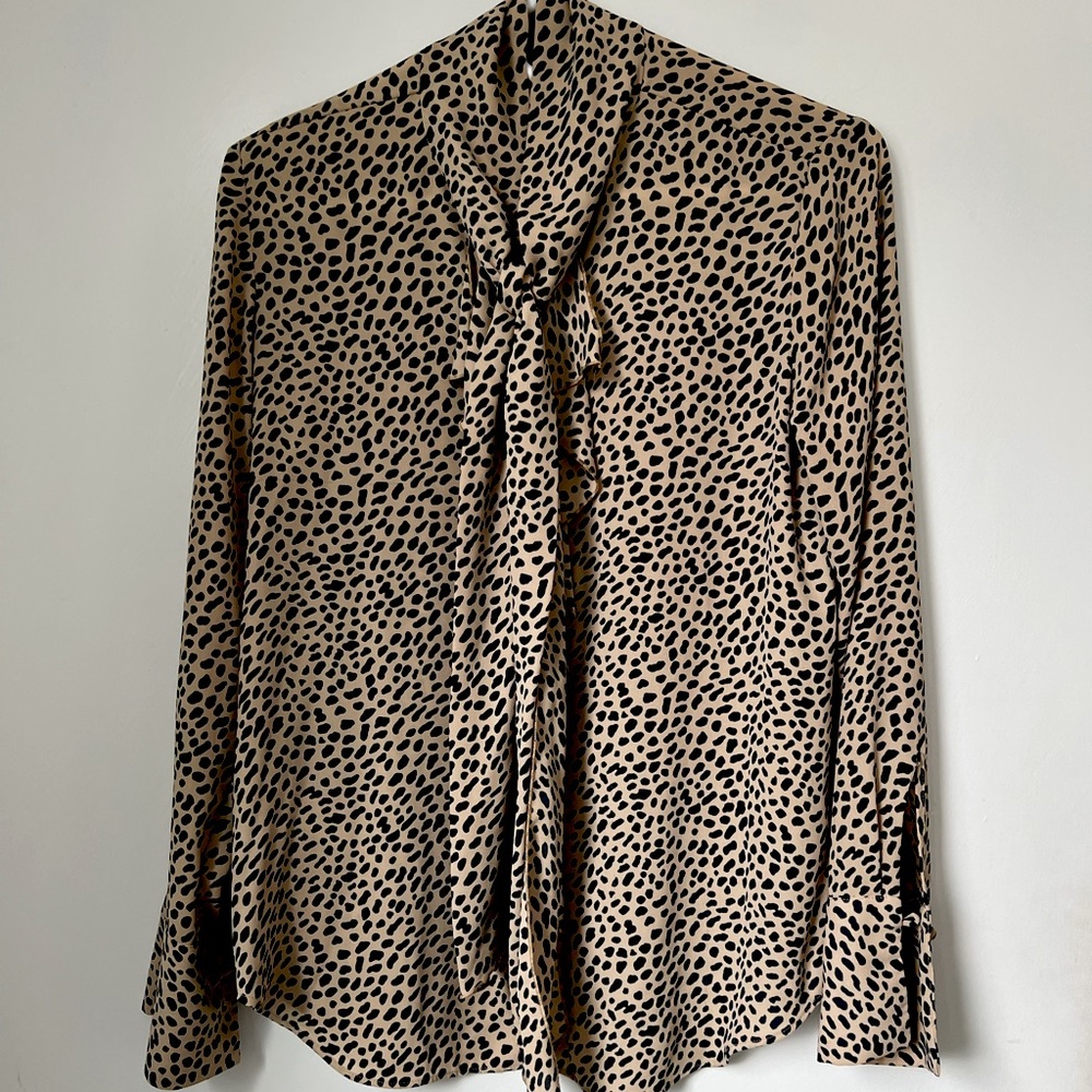 Long sleeved animal print blouse with tie neck by Ann Taylor. Size XS.